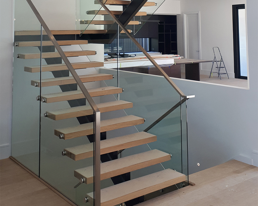 Steel staircase, glass balustrade and steel handrail - custom made and fabricated by the team at Absolute Metal Fabrications
